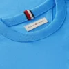 Lasten T-paita, jossa on samanvärinen lippulogo
