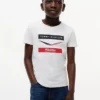 Lasten Tommy x Cadillac F1® Team Chevron -T-paita Lasten Tommy x Cadillac F1® Team Chevron -T-paita