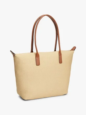 Monogram-logolla varustettu raffia-kassi