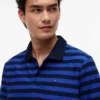 Tommy Jeans Regular Fit -raidallinen poolopaita Tommy Jeans Regular Fit -raidallinen poolopaita