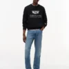 Tommy x Cadillac F1® Team Logo -huppari